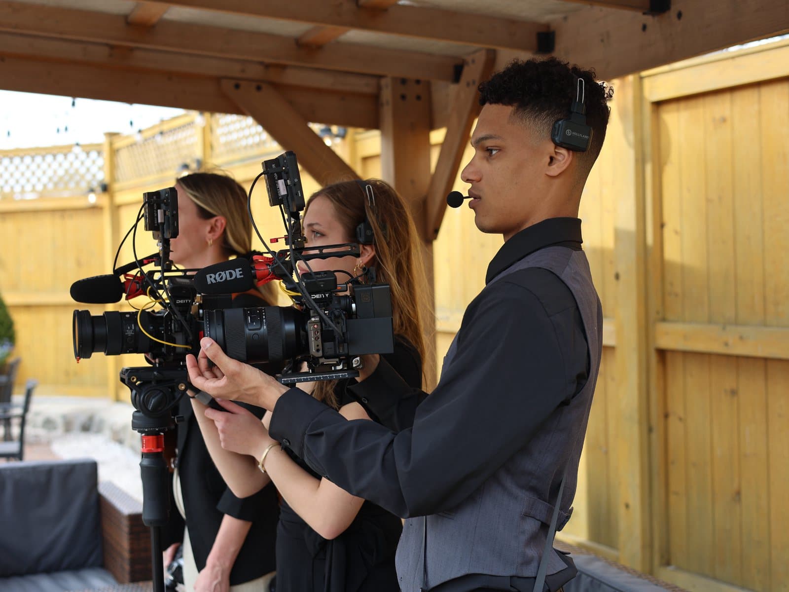 Skytona team members filming on set during a session.